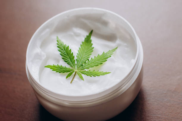 Cannabis topical package with green weed leaves. What are weed topicals? weed topicals for skin and acne. Best weed topicals to buy online.