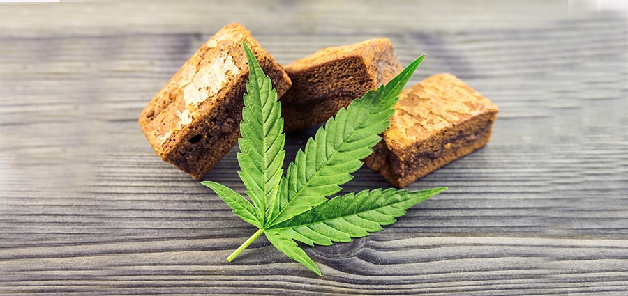 cannabis brownies and marijuana leaf. THC edibles for sale online.