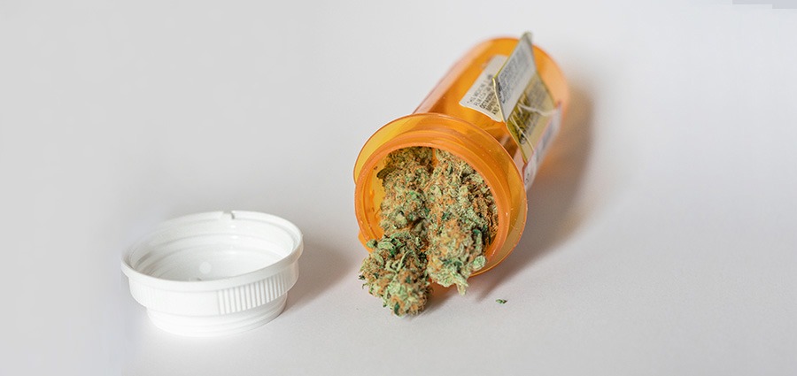 spilling medical marijuana zombie kush from a prescription bottle. buy weeds online. mail order weed canada. weed online. 