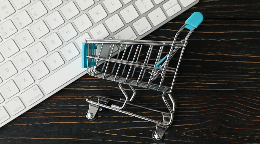 shop cart and keyboard on wooden background online shopping | My Green Solution